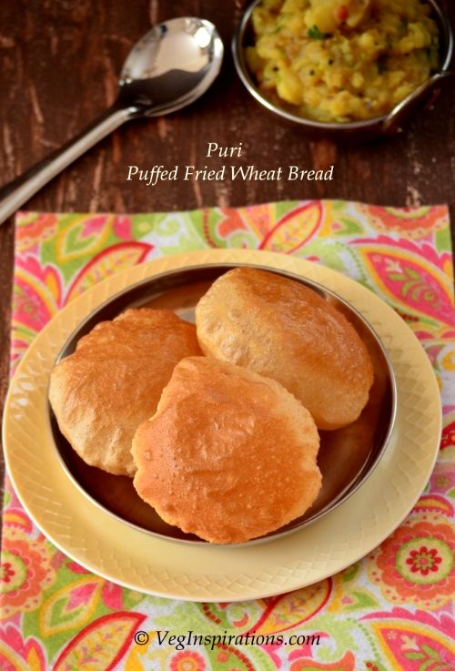 Puri ~ Poori ~ Puffed fried Indian whole wheat bread ~ With Stepwise pictures and a video clip